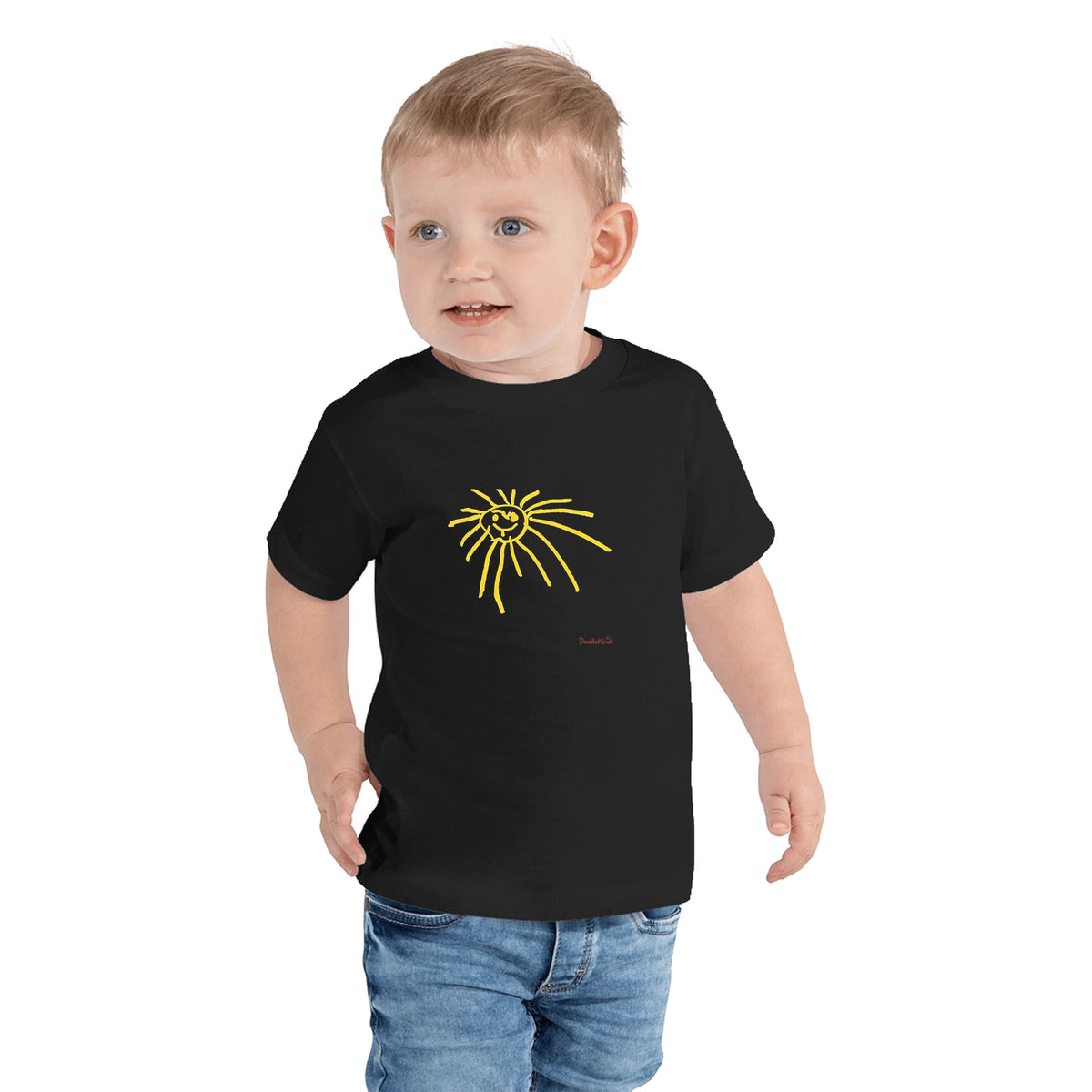 Your kid's drawing tee for kids in black: the drawing printed big on the front with a small DoodleKind signature in the bottom right corner. Example shows Funny Sun by Allie, age 4.